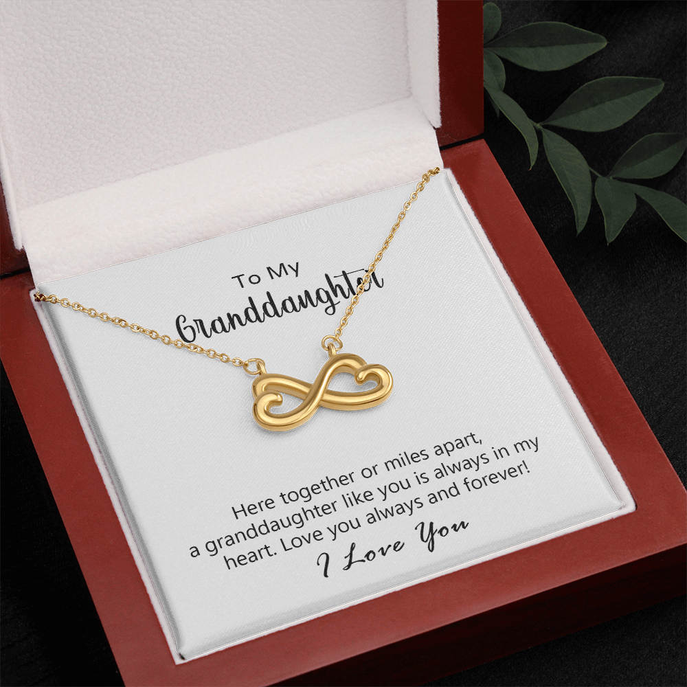 Infinite Love Necklace on display, sparkling finish
