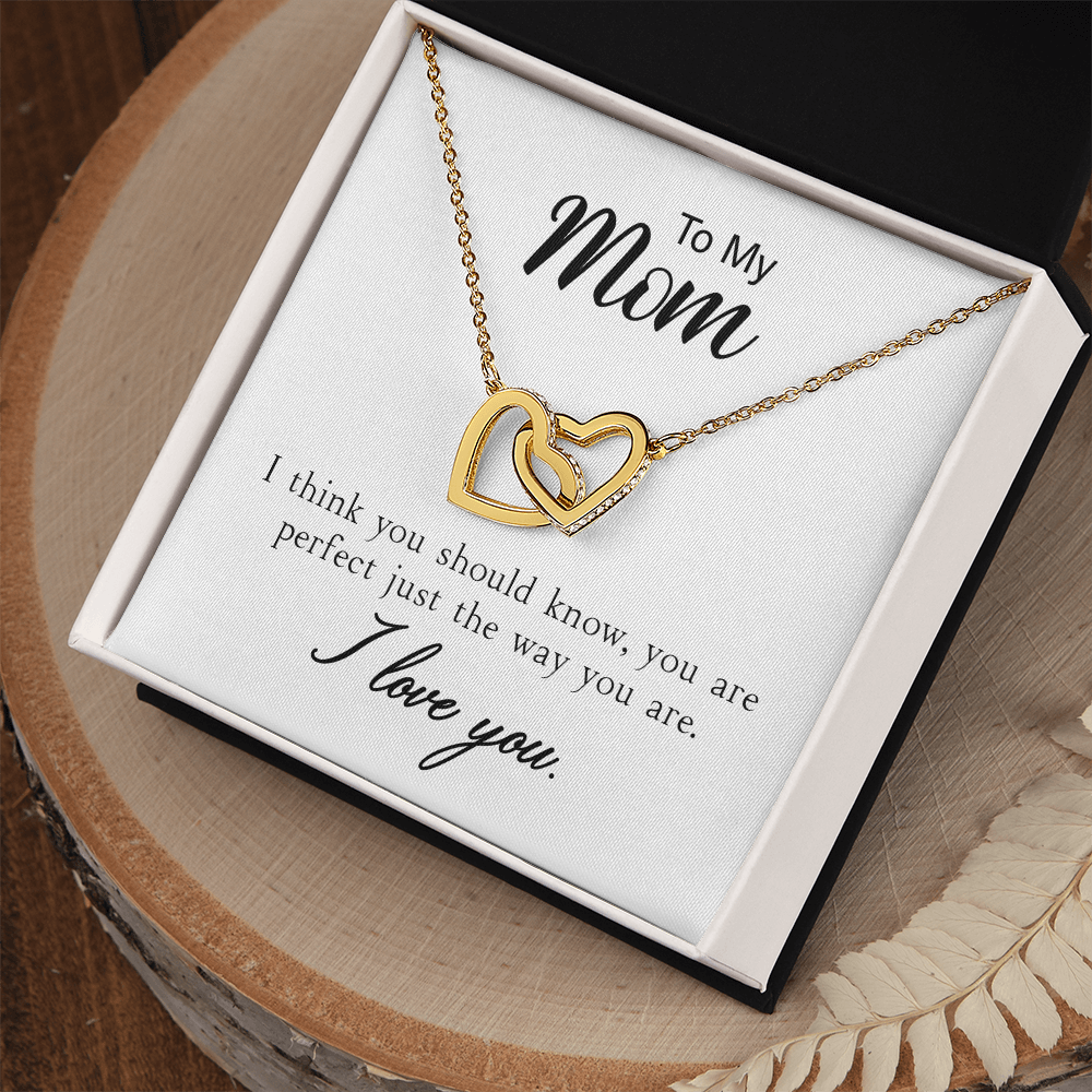 Bound Hearts Necklace displayed with its message card