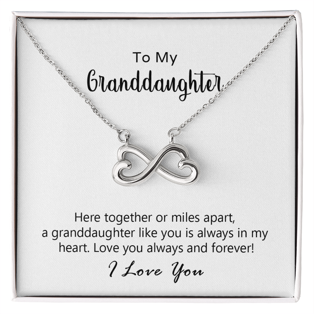 Close-up of the heart-shaped infinity pendant