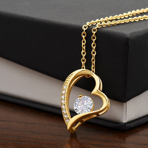 Held Close Necklace displayed with its message card